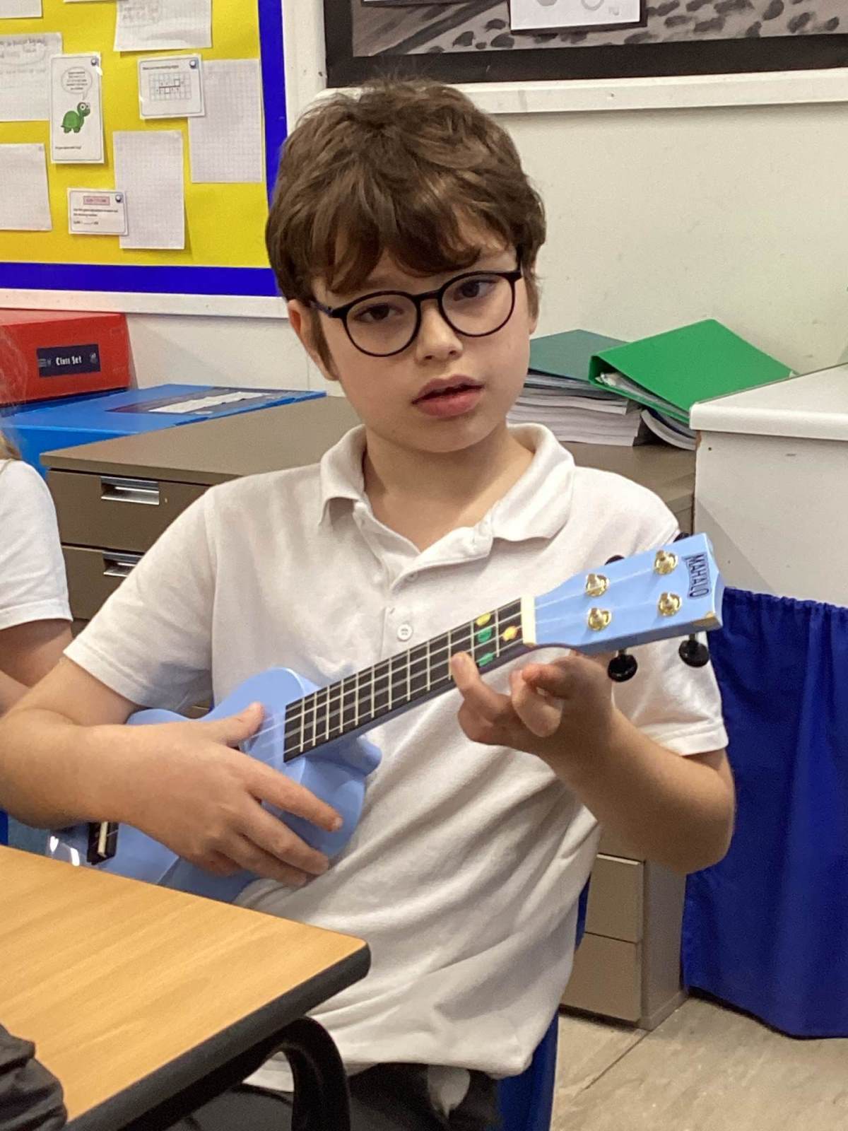 Learning to play the ukulele.